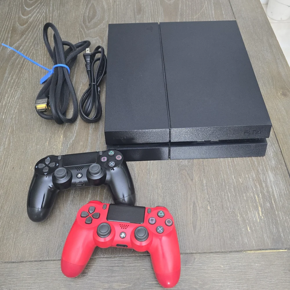 Sony PlayStation 4 Console with Black and Red Controllers